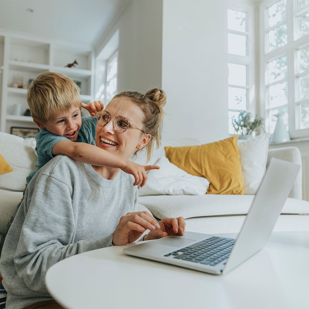mother and son on laptop
