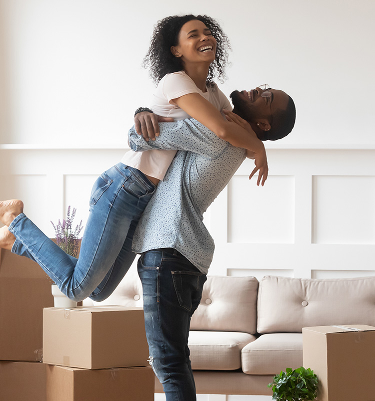 couple hugging in new home