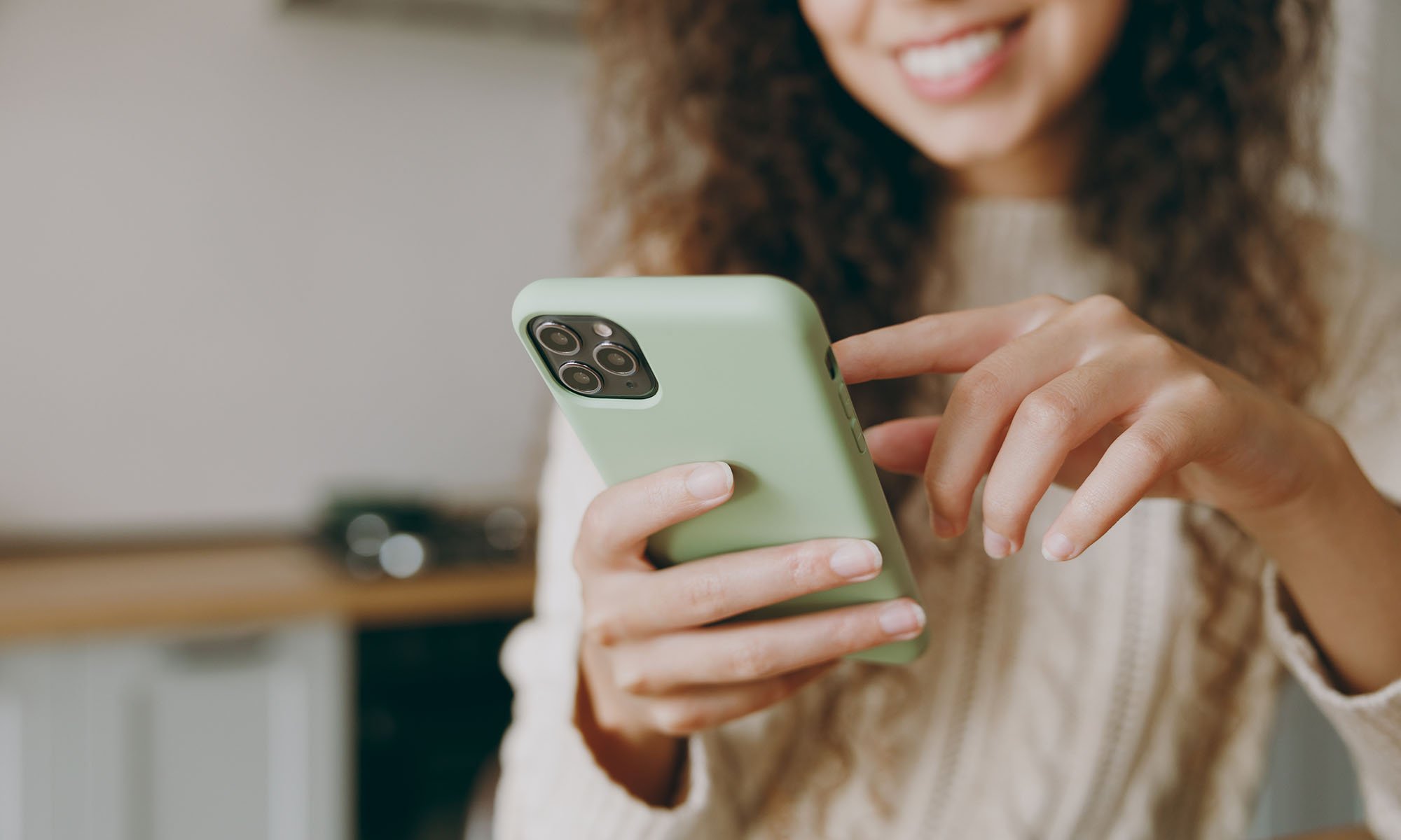 woman managing card on mobile device
