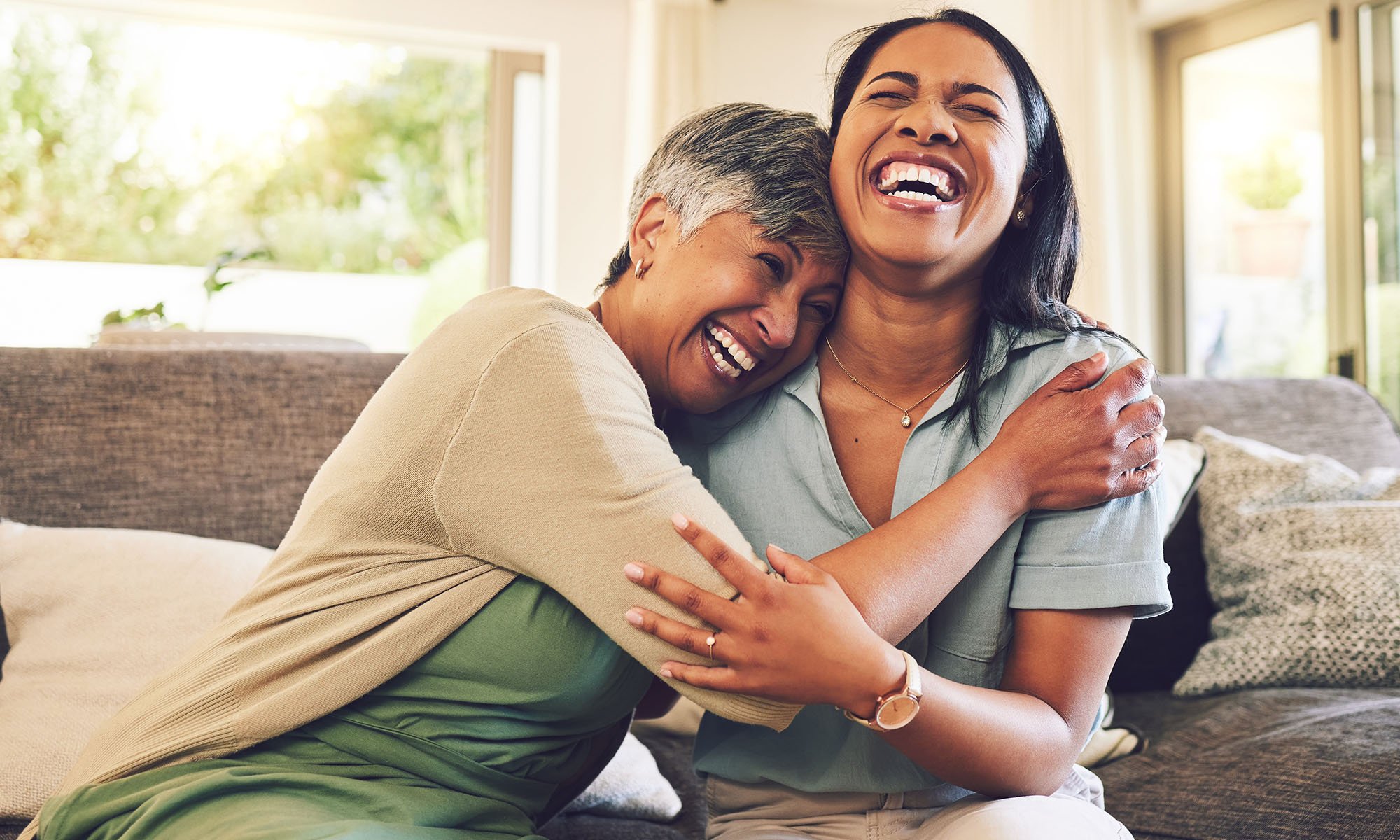 mom and daughter laughing together
