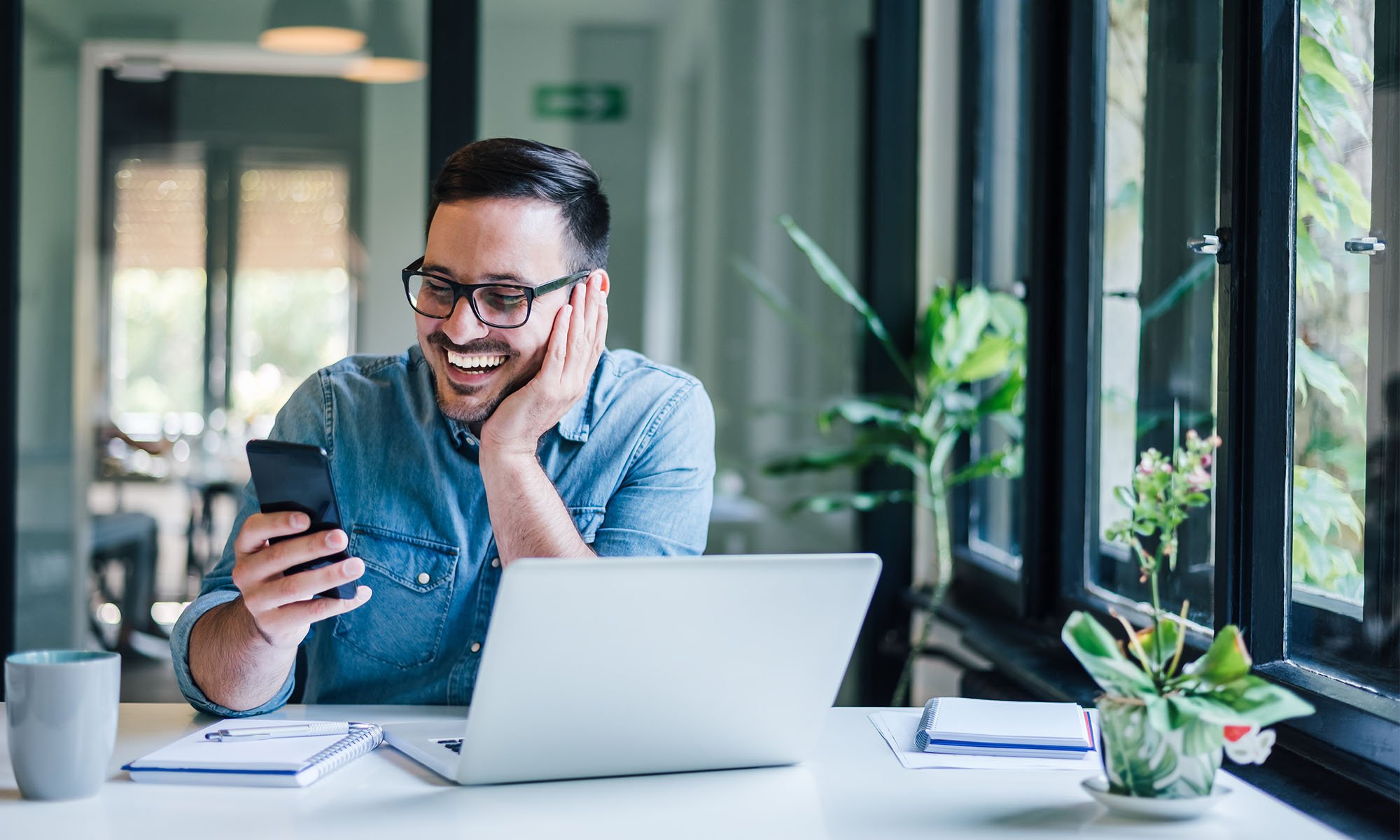 business owner on mobile device banking