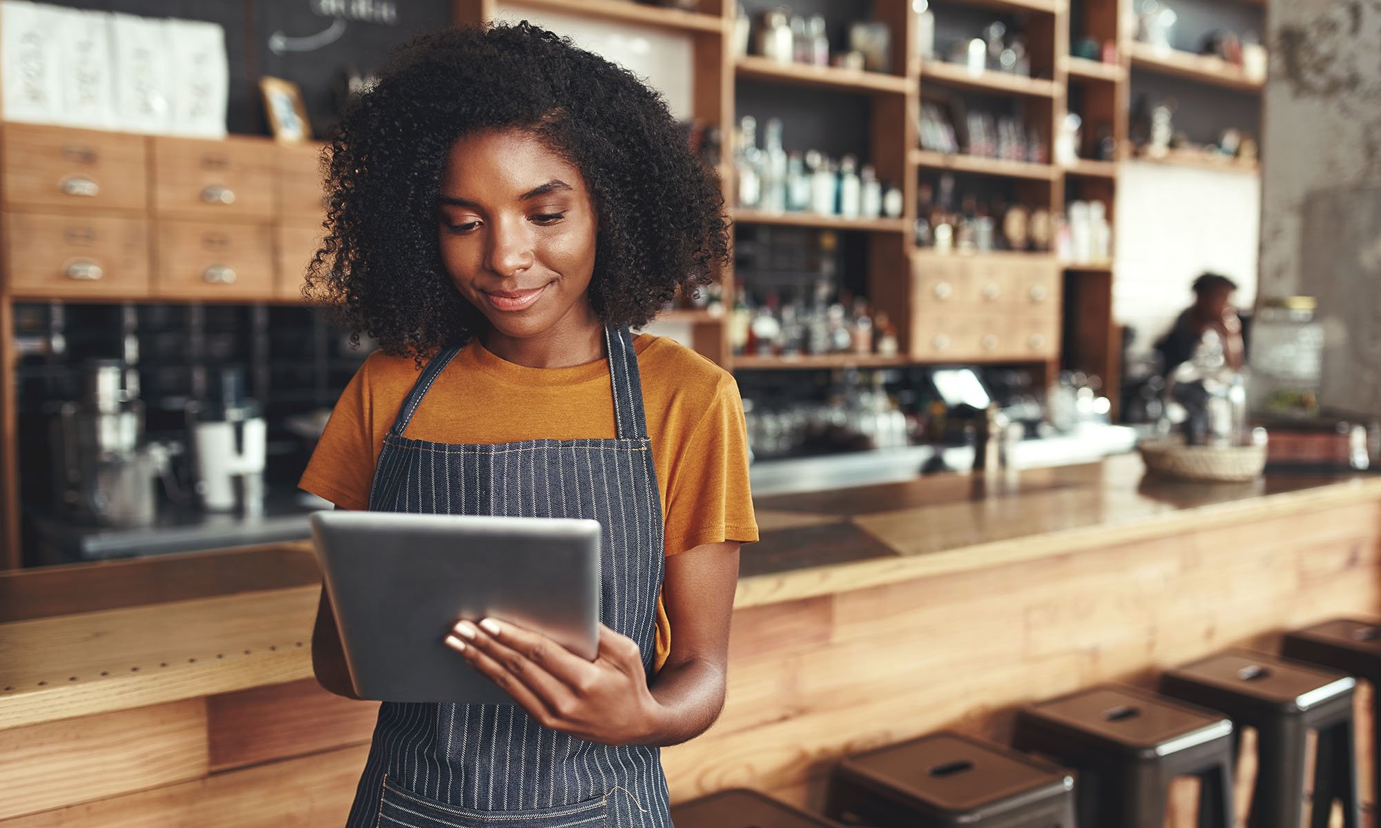restaurant owner working on tablet