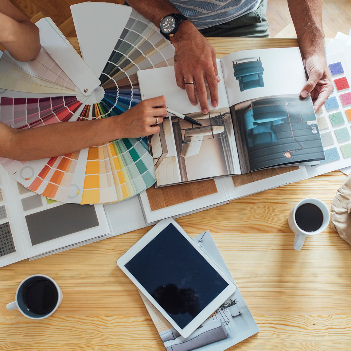 couple picking out renovation colors and furniture